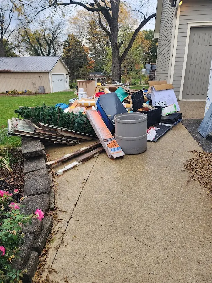 Dumpster being loaded with debris for Demolition Dumpster Rental in Waterloo